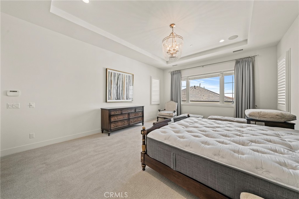 52 Eider Run Irvine, CA 92618 - Photo 41 of 46 a bedroom with a bed and a large window