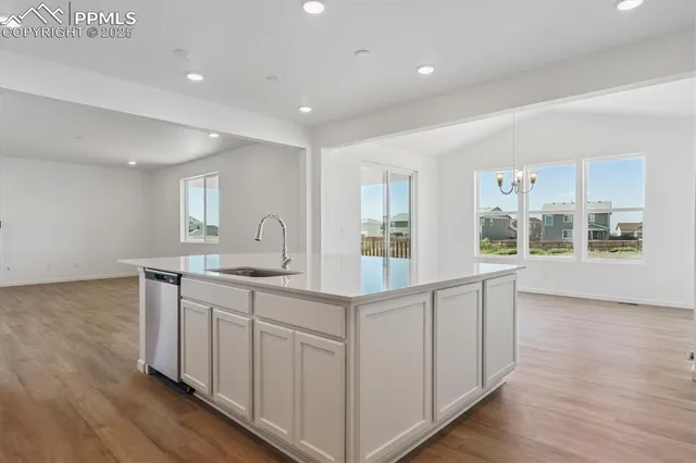 a kitchen with sink and cabinets