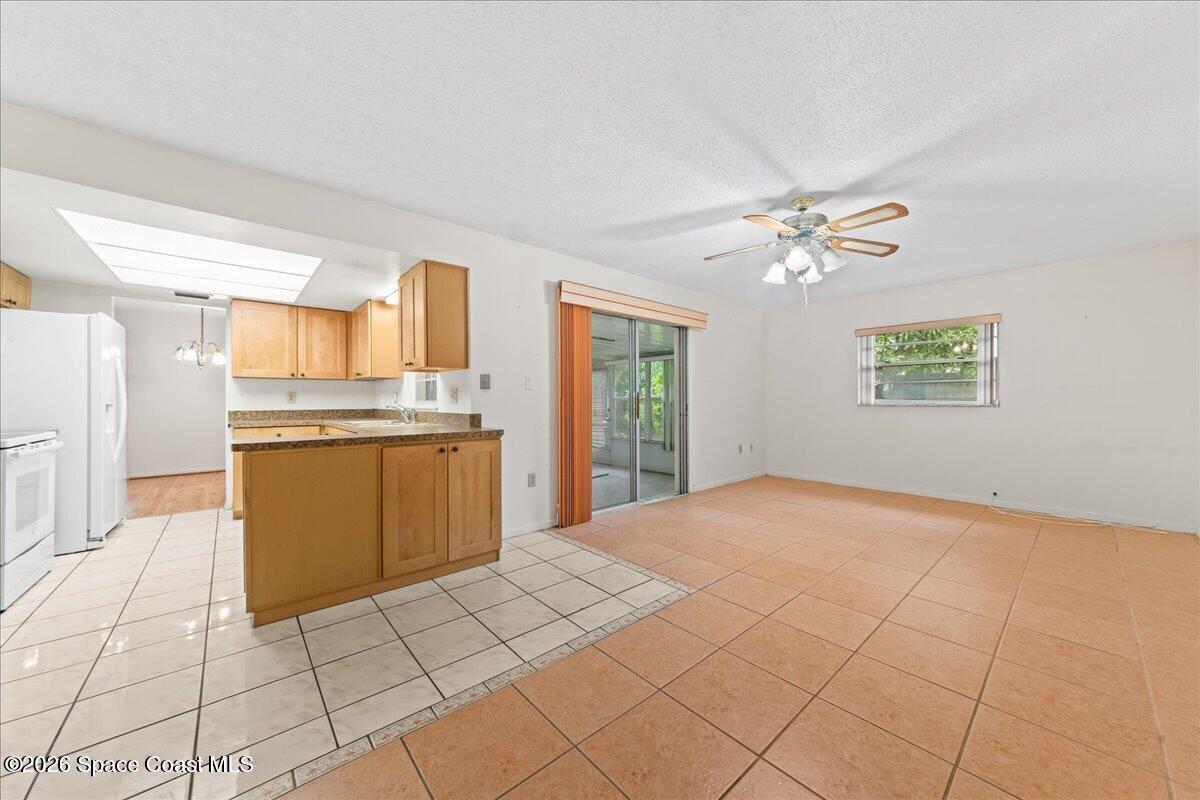2066 Acacia Street Northeast Palm Bay, FL 32905 - Photo 11 of 28 a view of a kitchen with electric appliances