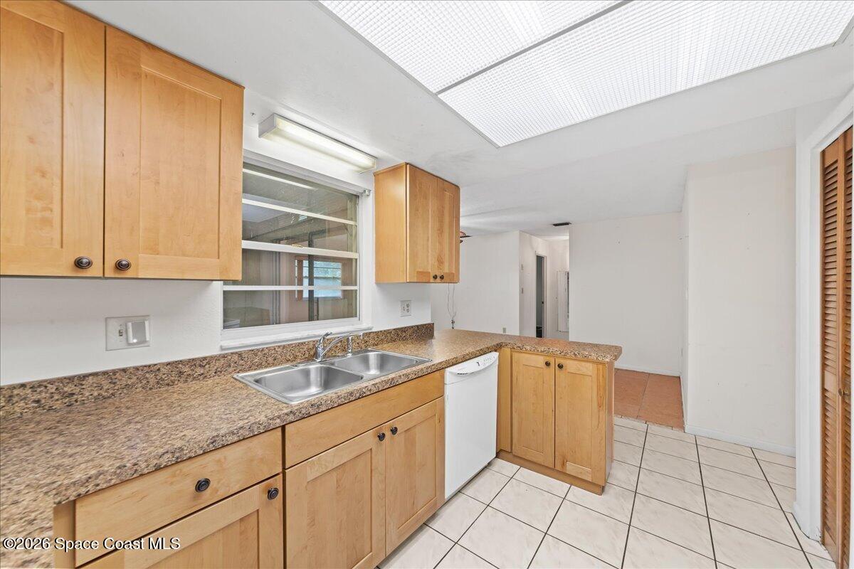 2066 Acacia Street Northeast Palm Bay, FL 32905 - Photo 15 of 28 a kitchen with a sink and cabinets