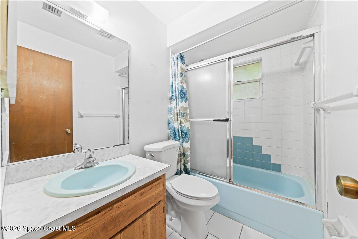 2066 Acacia Street Northeast Palm Bay, FL 32905 - Photo 20 of 28 a bathroom with a sink toilet and shower