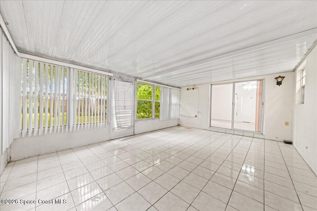 2066 Acacia Street Northeast Palm Bay, FL 32905 - Photo 23 of 28 a view of an empty room with a window