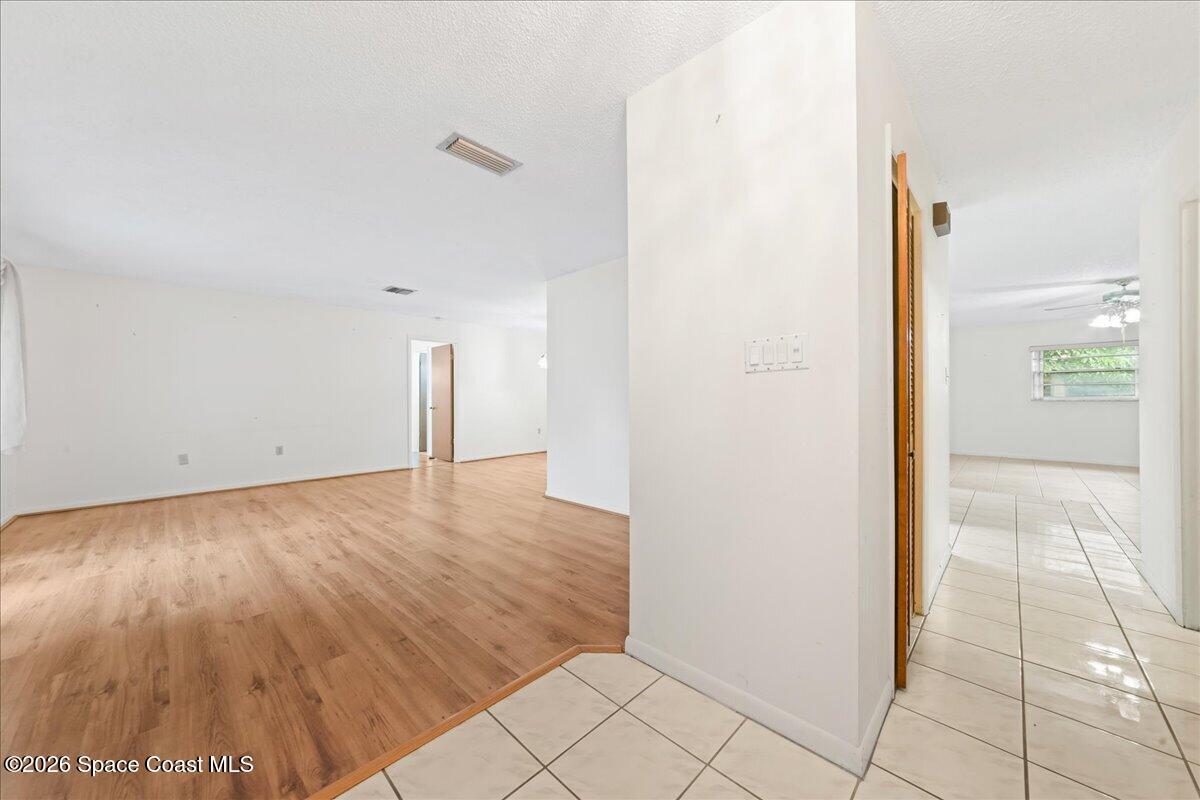 2066 Acacia Street Northeast Palm Bay, FL 32905 - Photo 6 of 28 a view of a room with an empty space and a window
