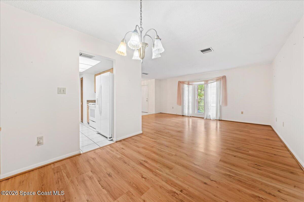 2066 Acacia Street Northeast Palm Bay, FL 32905 - Photo 7 of 28 a view of livingroom with hardwood floor and window