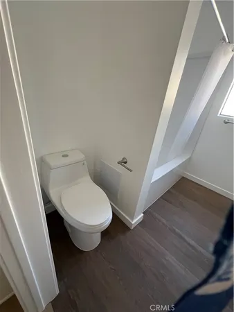 a bathroom with a toilet and a sink