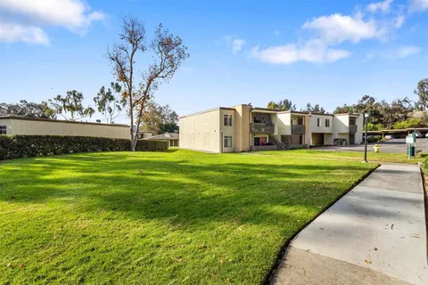 a view of a house with a big yard