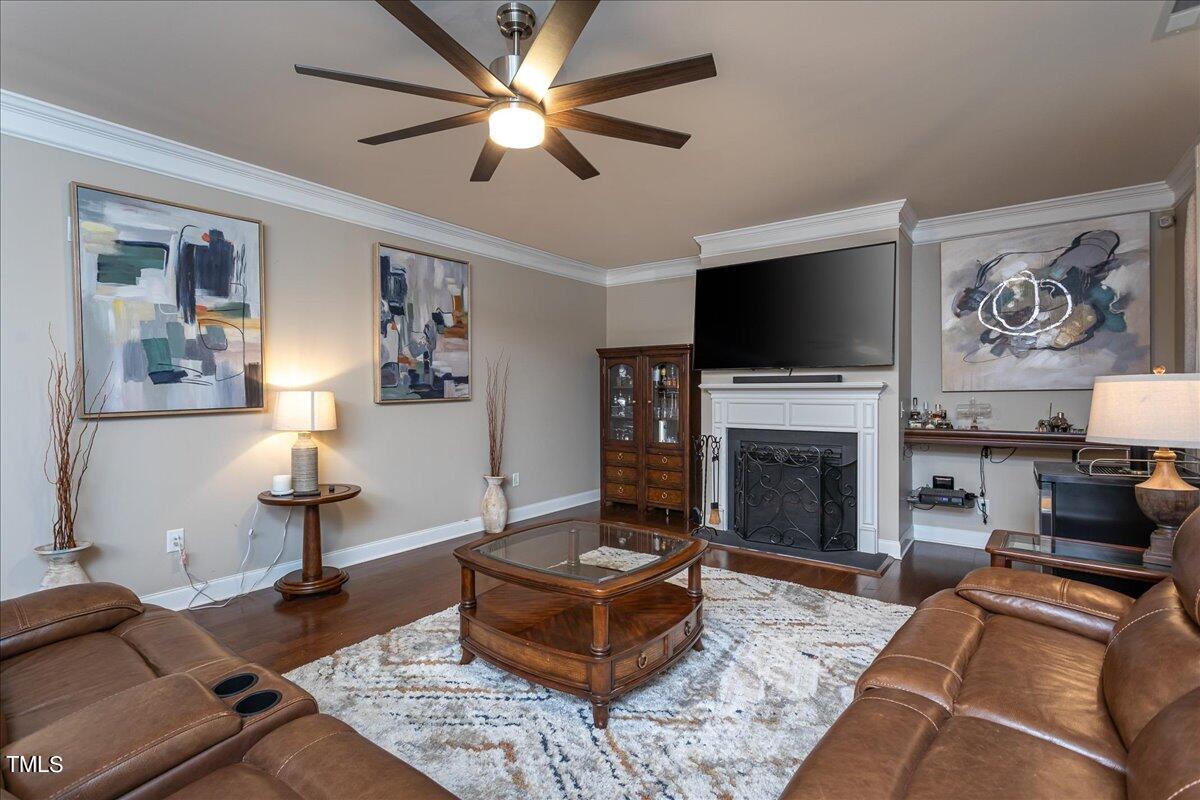 7656 Channery Way Raleigh, NC 27616 - Photo 17 of 44 a living room with furniture and a fireplace