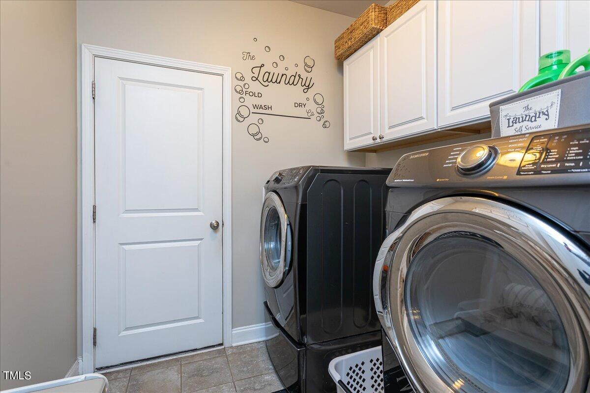 7656 Channery Way Raleigh, NC 27616 - Photo 19 of 44 a utility room with dryer and washer