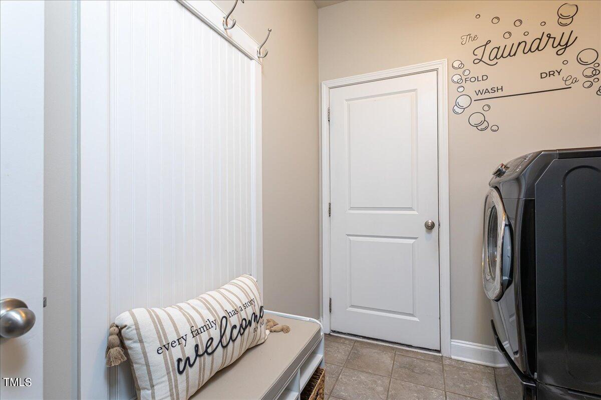7656 Channery Way Raleigh, NC 27616 - Photo 20 of 44 a bedroom with a bed and a mirror