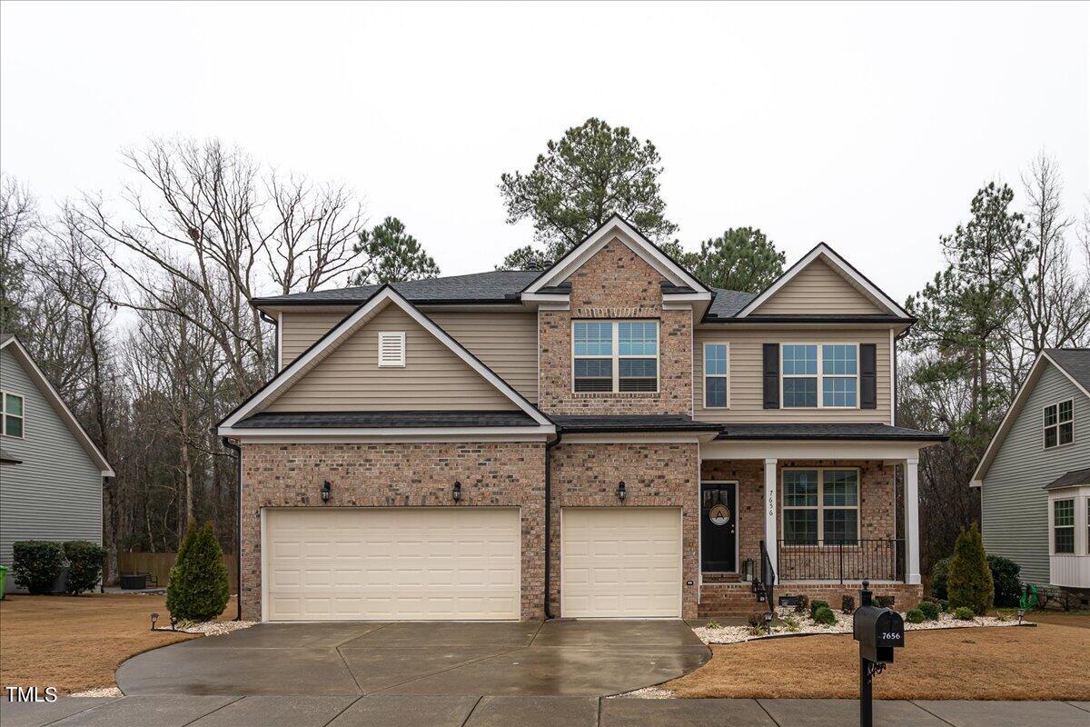 7656 Channery Way Raleigh, NC 27616 - Photo 2 of 44 a front view of a house with garage