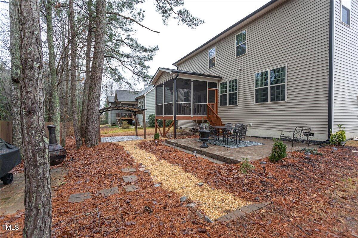 7656 Channery Way Raleigh, NC 27616 - Photo 41 of 44 a front view of a house with garden