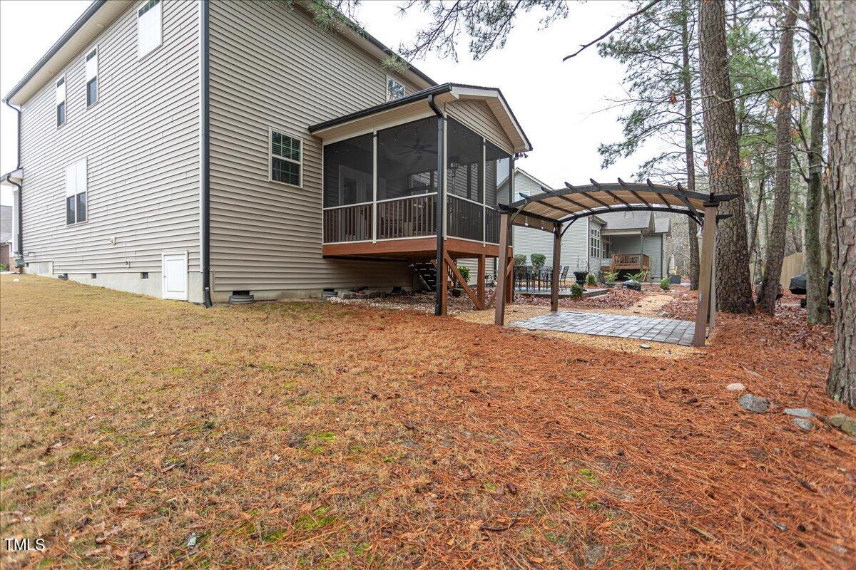 7656 Channery Way Raleigh, NC 27616 - Photo 43 of 44 a view of a house with backyard and sitting area