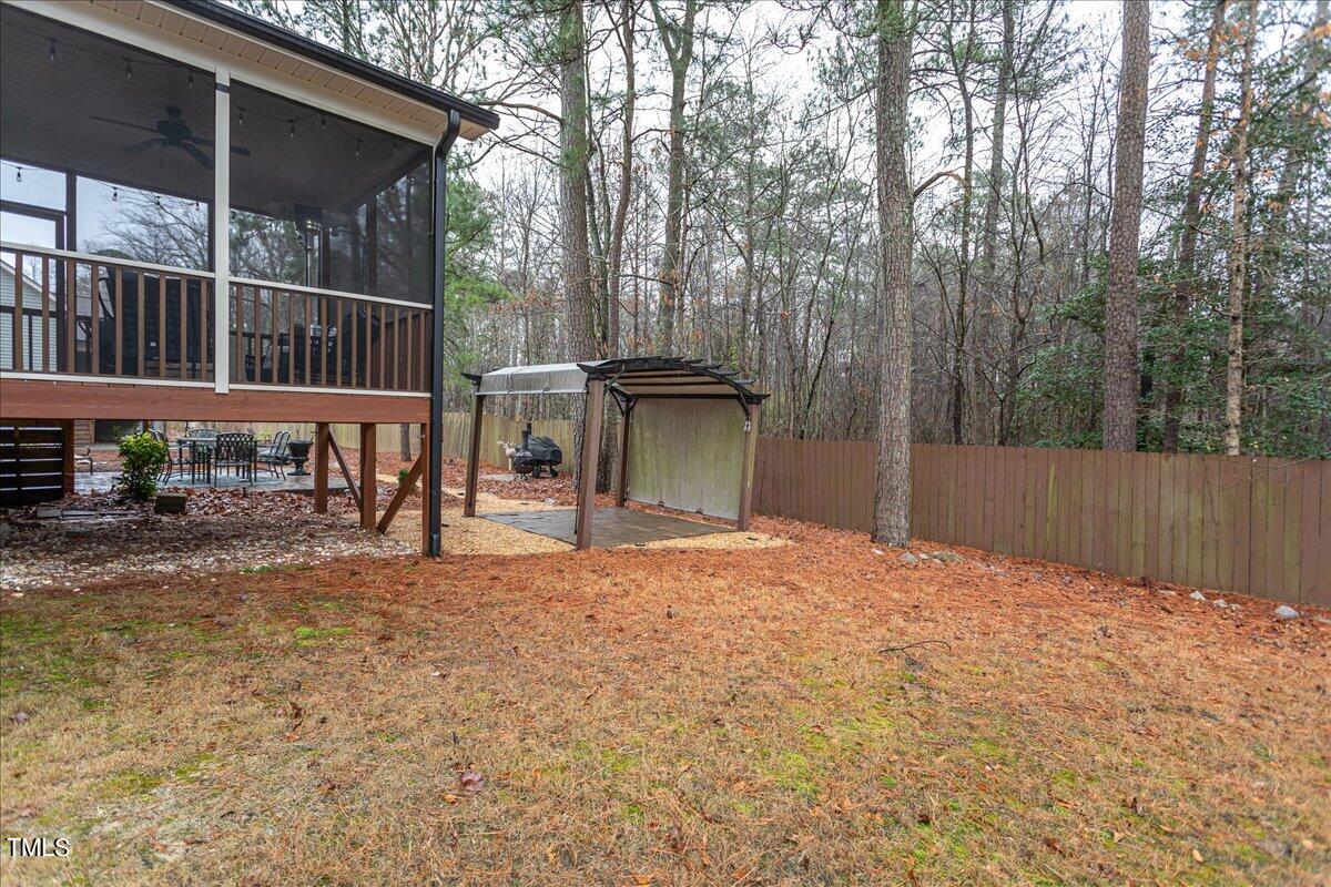7656 Channery Way Raleigh, NC 27616 - Photo 44 of 44 a view of backyard with deck and seating space