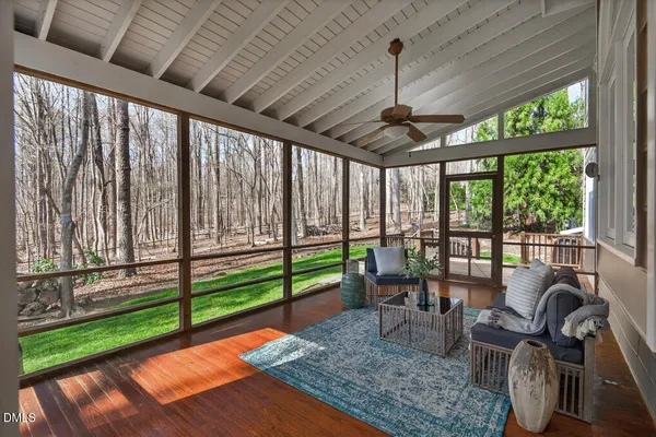 a bathroom with a toilet a sink and a mirror