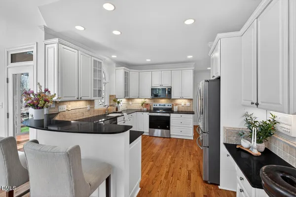 a bathroom with sinks a large mirror and shower