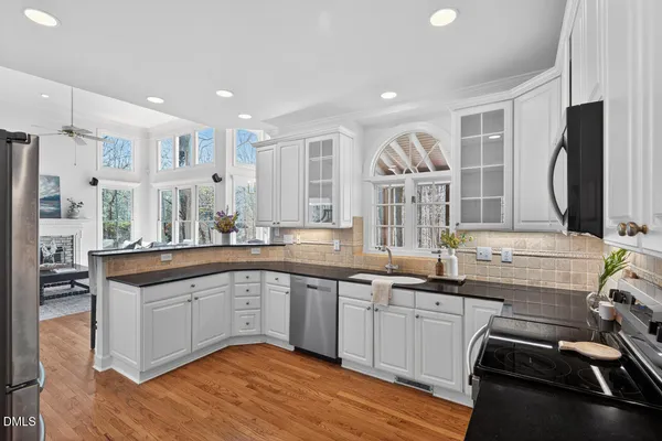a bathroom with a granite countertop bathtub and shower