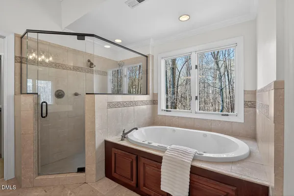 a bathroom with a sink a vanity and a window