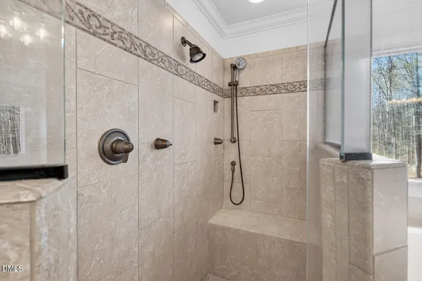 a view of a backyard with a large window and wooden floor