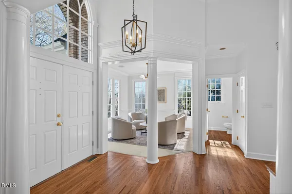 a living room with furniture a fireplace and a large window