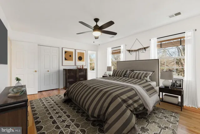 a view of an empty room and wooden floor
