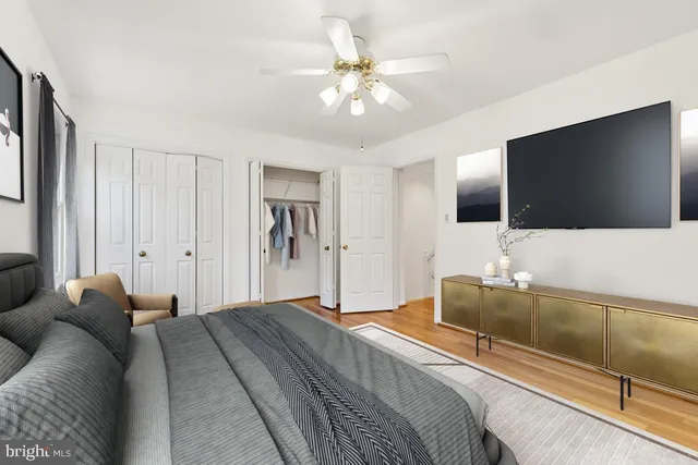 a spacious bathroom with a shower sink and mirror