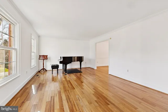a view of dining room with furniture and wooden floor