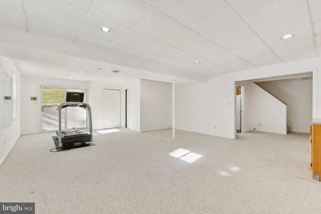 a view of outdoor space with pool and wooden floor
