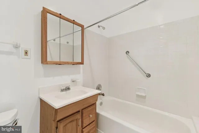 a front view of a house with a yard table and chairs