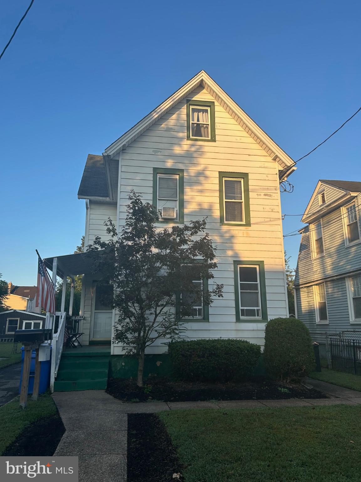 126 Delaware Avenue, Unit B Riverside, NJ 08075 - Photo 1 of 9 a front view of a house with a yard