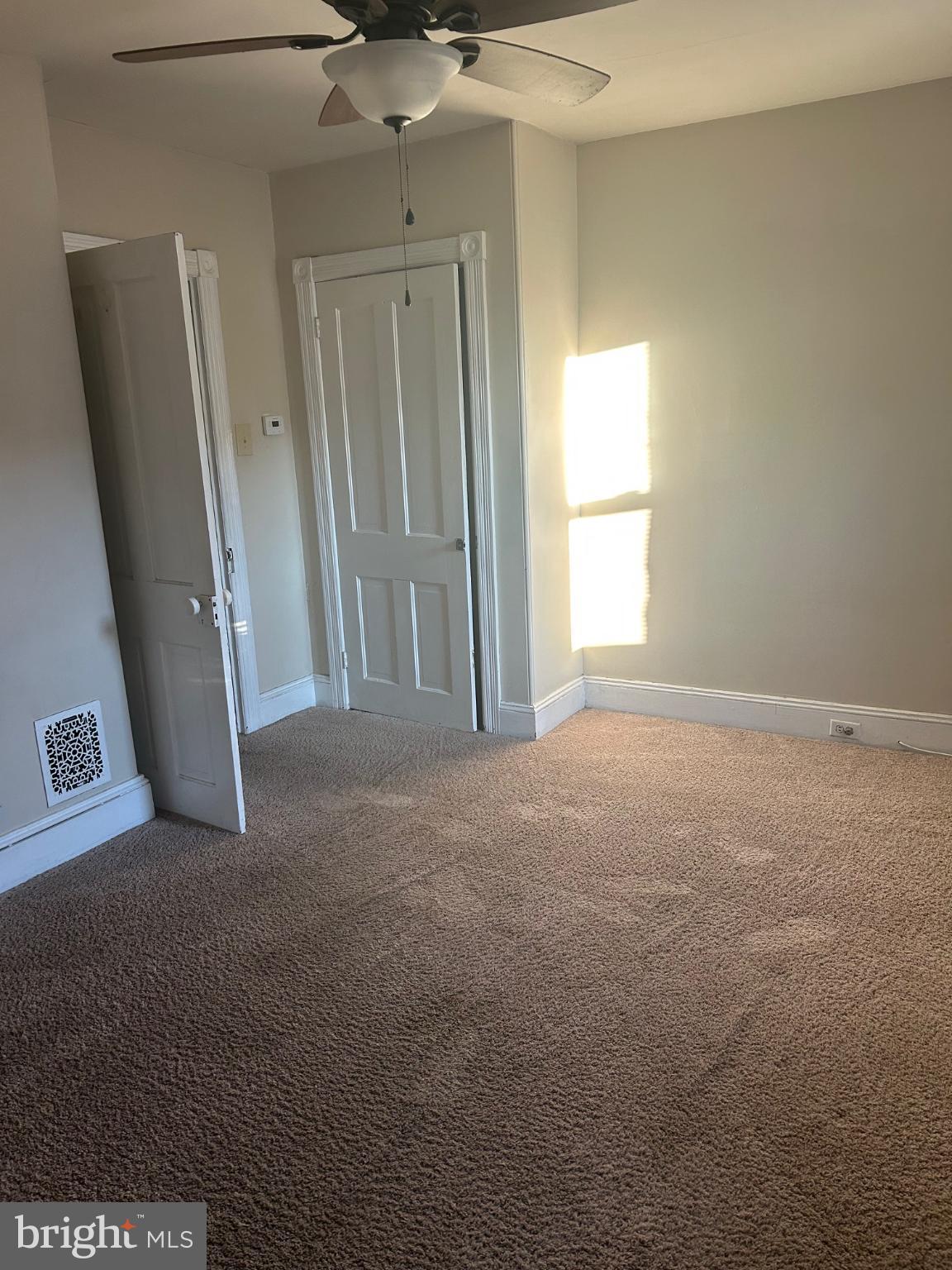 126 Delaware Avenue, Unit B Riverside, NJ 08075 - Photo 8 of 9 an empty room with windows and closet