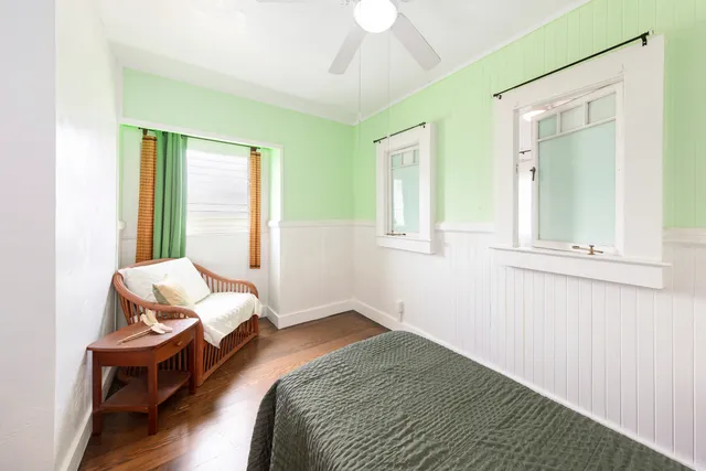 a bedroom with a bed and window