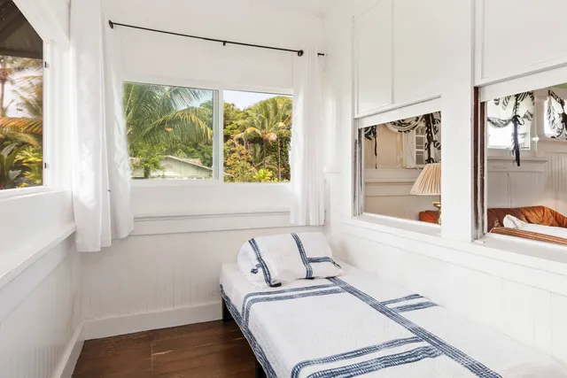 a room with a bed and a window