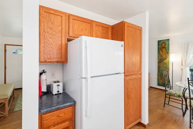 a white refrigerator freezer sitting in a kitchen