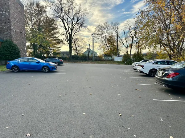 a view of street with parked cars