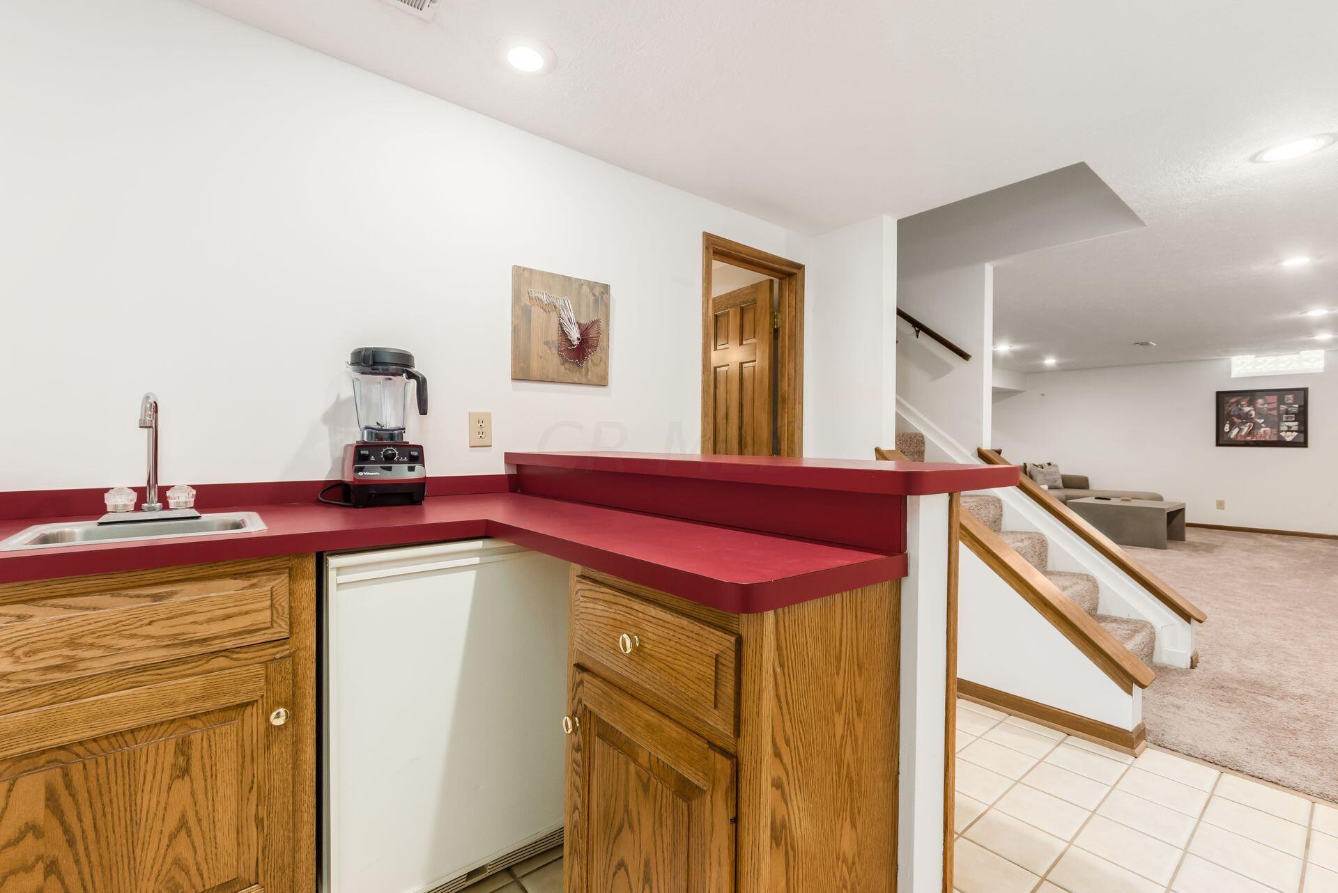 1044 Rutland Way Columbus, OH 43085 - Photo 55 of 67 Lower level wet bar with beverage center