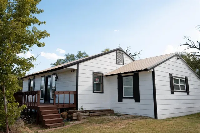 a front view of a house with stairs