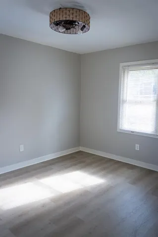 a bathroom with a toilet a sink and shower
