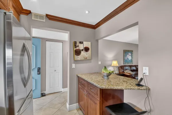 a view of a dining room with furniture and window