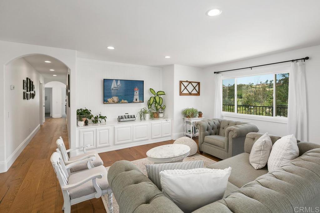 7880 Calle Dos Lagos Rancho Santa Fe, CA 92067 - Photo 11 of 44 a living room with furniture and a flat screen tv