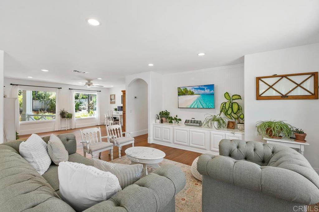 7880 Calle Dos Lagos Rancho Santa Fe, CA 92067 - Photo 13 of 44 a living room with furniture and a large window