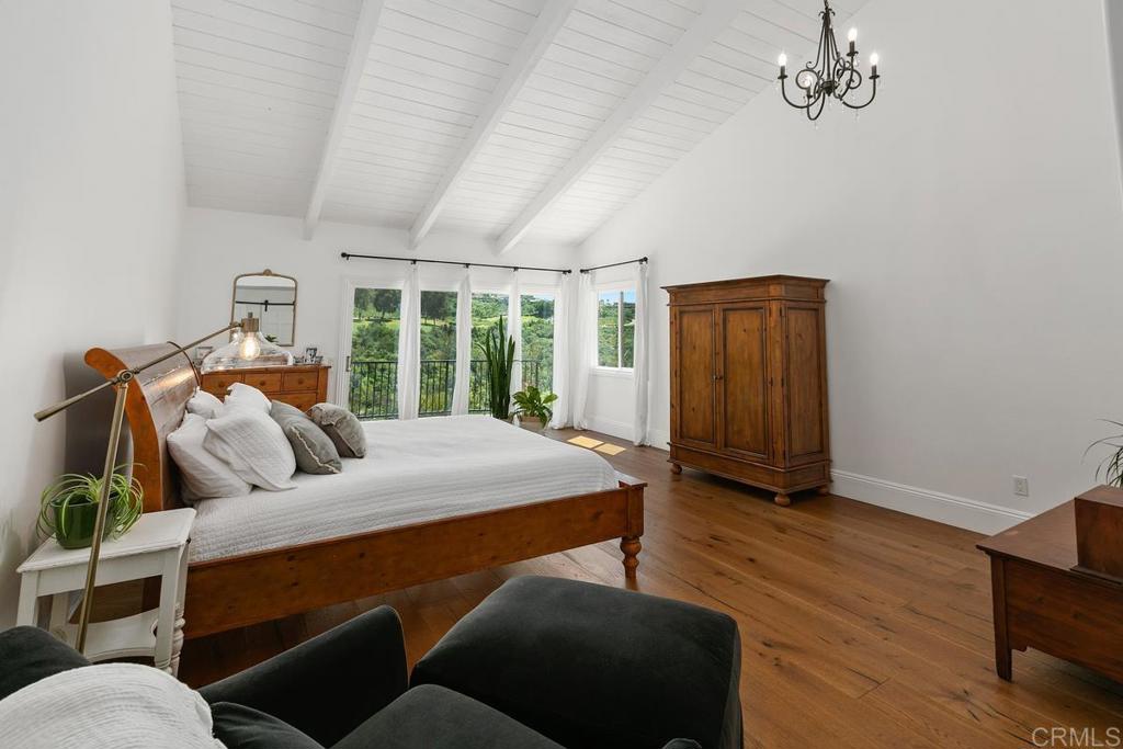 7880 Calle Dos Lagos Rancho Santa Fe, CA 92067 - Photo 16 of 44 a bed room with furniture and a window