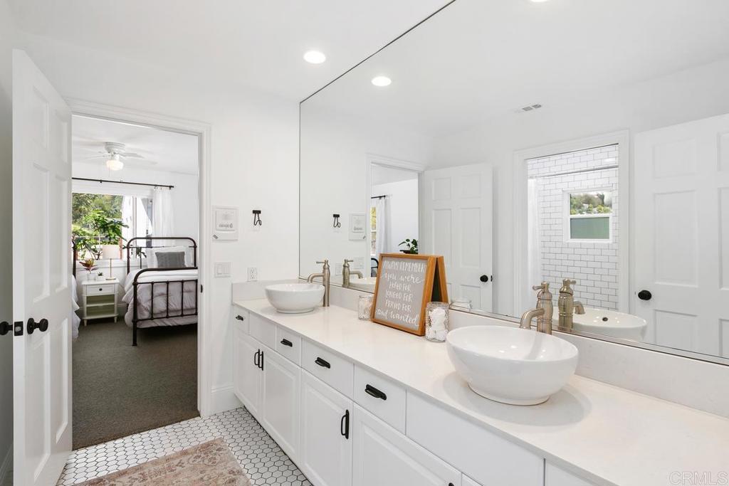7880 Calle Dos Lagos Rancho Santa Fe, CA 92067 - Photo 21 of 44 a en suite spacious bathroom with double sink and a mirror