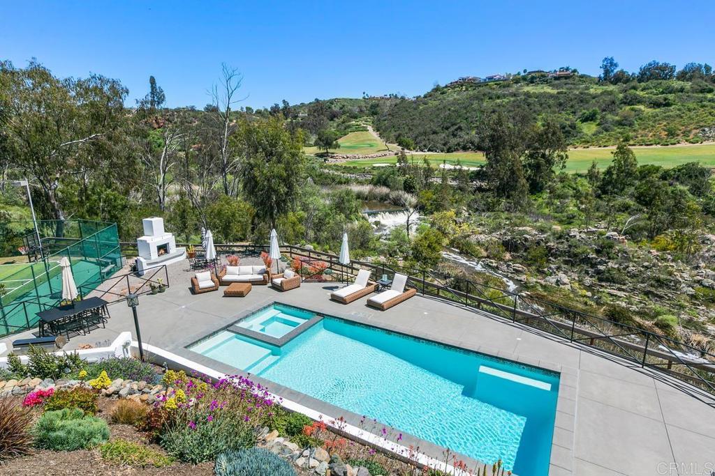 7880 Calle Dos Lagos Rancho Santa Fe, CA 92067 - Photo 29 of 44 a view of a backyard with plants and outdoor seating