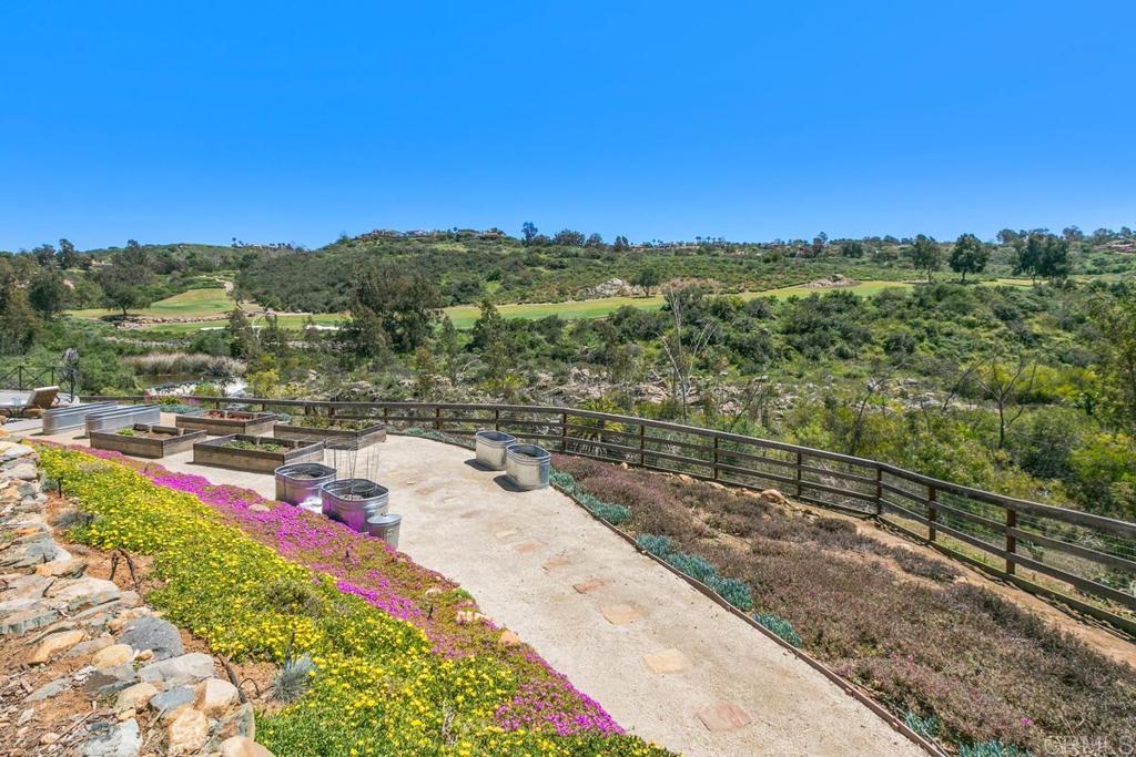 7880 Calle Dos Lagos Rancho Santa Fe, CA 92067 - Photo 31 of 44 a view of a yard with wooden fence