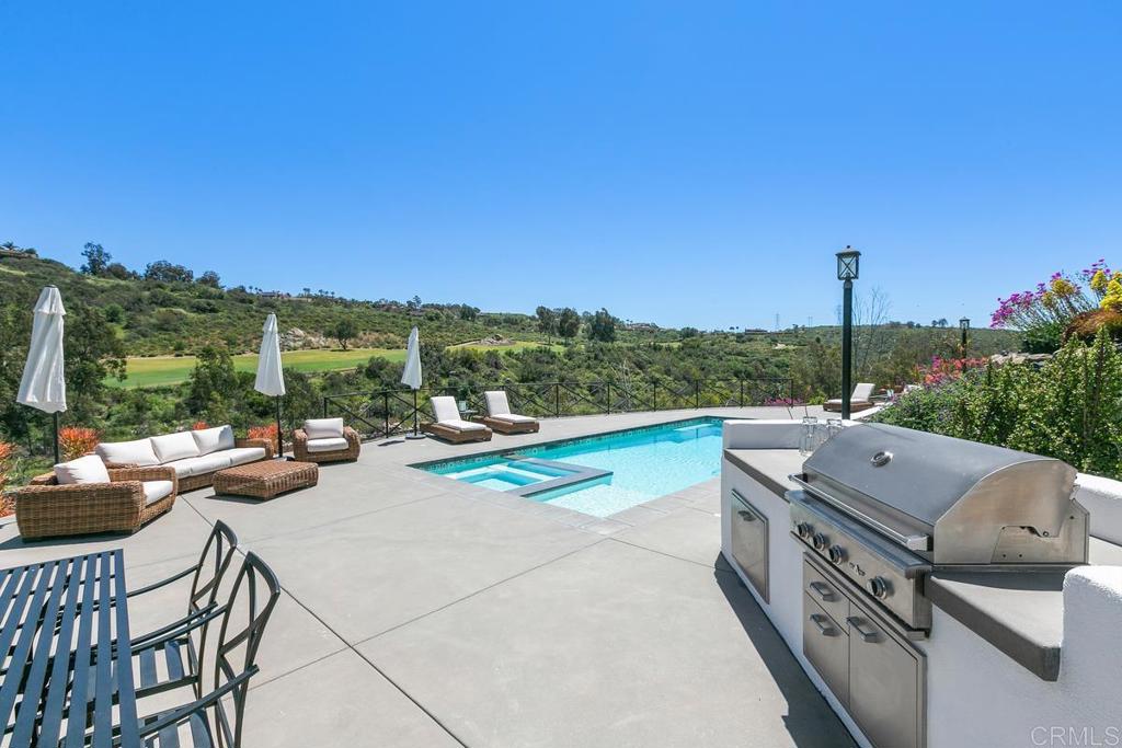 7880 Calle Dos Lagos Rancho Santa Fe, CA 92067 - Photo 33 of 44 a view of a terrace with couches and city view