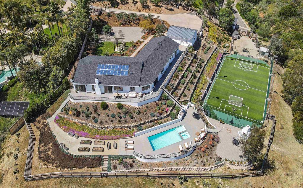 7880 Calle Dos Lagos Rancho Santa Fe, CA 92067 - Photo 42 of 44 a view of a house with a yard