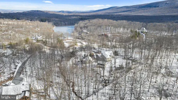 a view of lake with mountain in the background