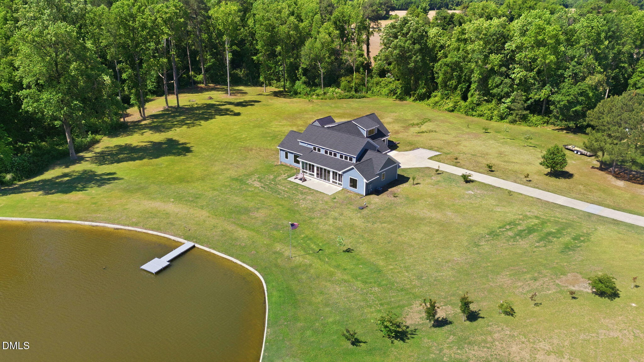 35 North Rippling Court Smithfield, NC 27577 - Photo 50 of 59 a backyard of a house with a yard and outdoor seating