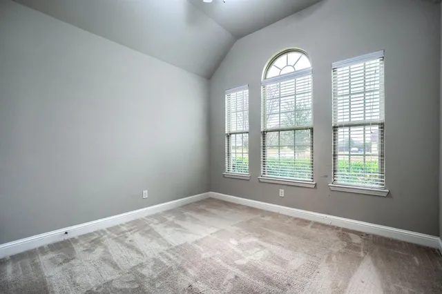 a bathroom with a sink double vanity granite tub shower and a mirror