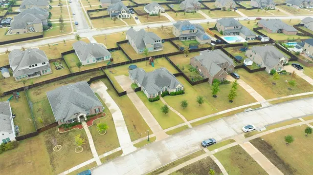 a aerial view of a house with swimming pool